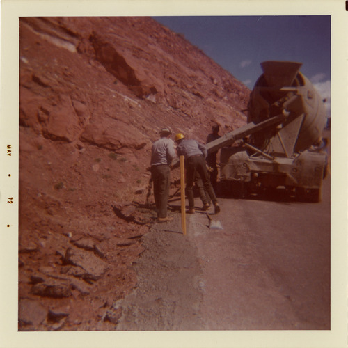 Men operating construction vehicles during road repair of Kolob Canyon Road.
