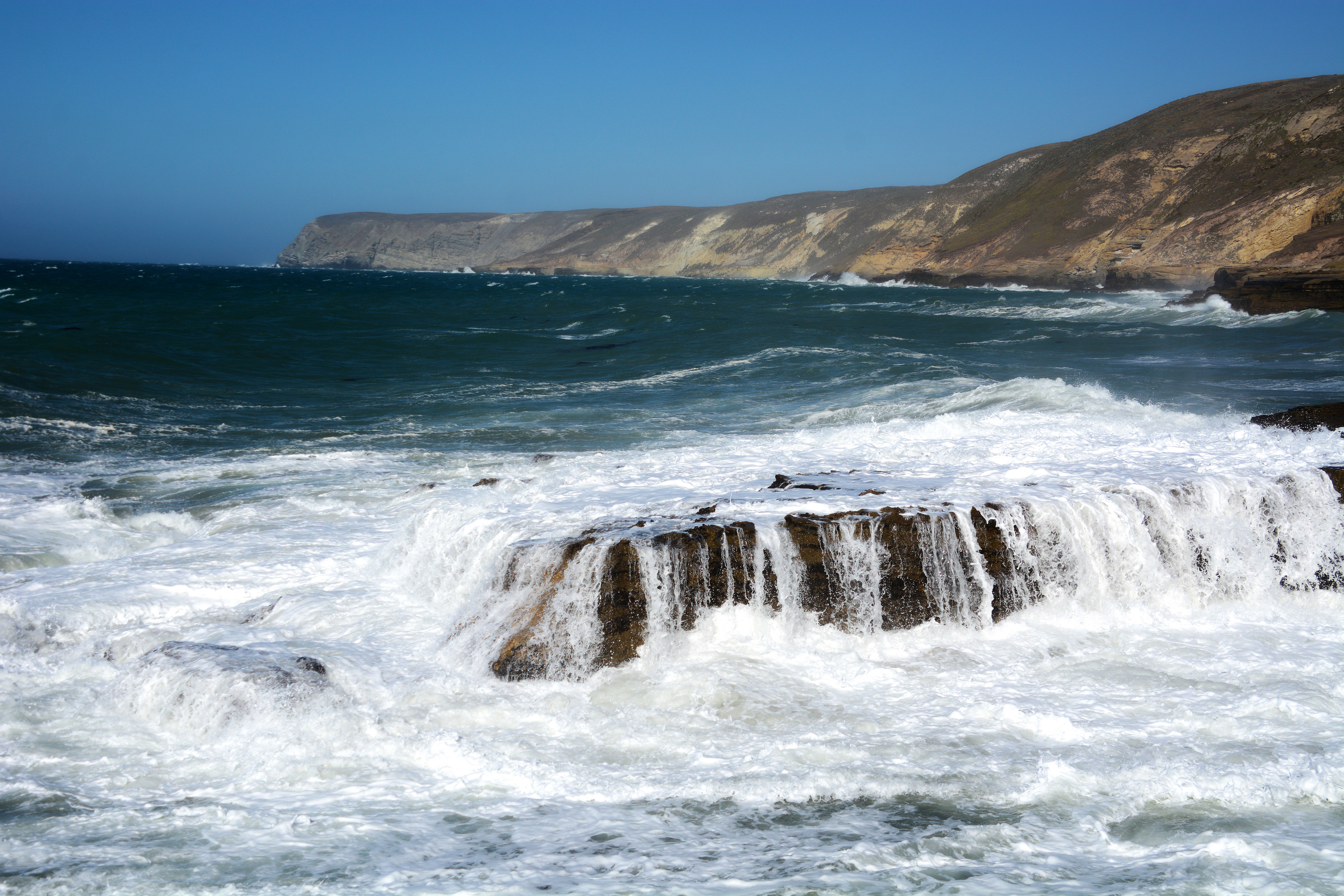 coast with crashing waves