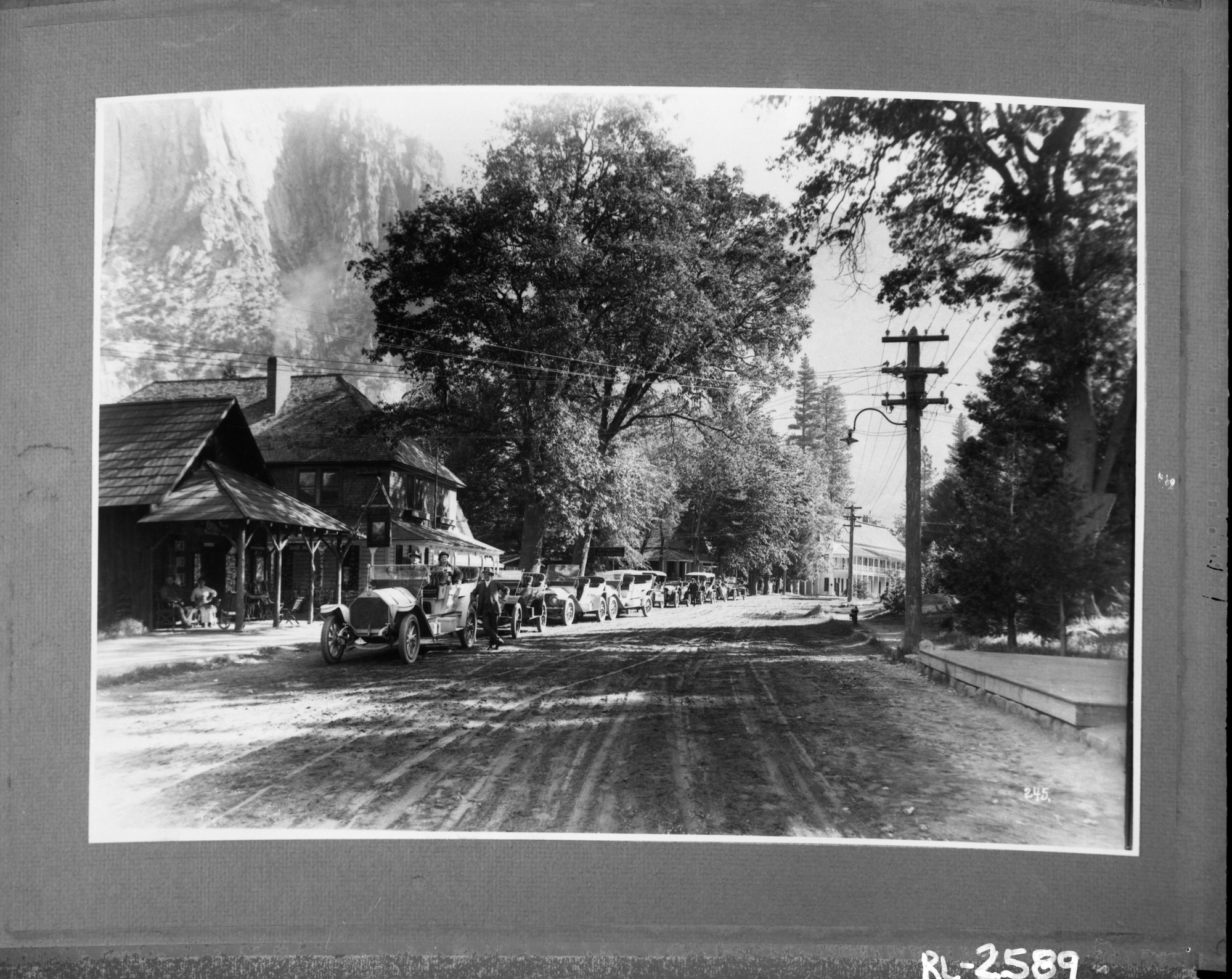 Line-up of auto stages in Old Village. See also RL-8776 [and RL-9856].