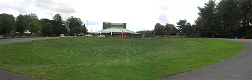 A maintained turf area with marking tape around the perimeter of the future native garden in front of the Filene Center 