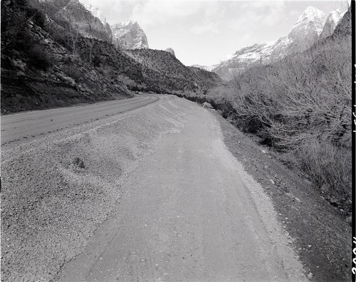 Windrow of gravel ready for spreading-realignment of park road project.