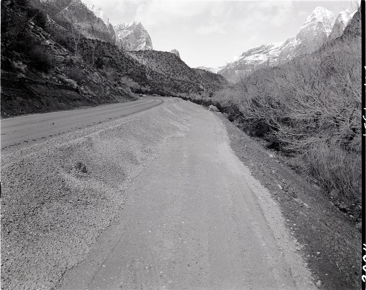Windrow of gravel ready for spreading-realignment of park road project.