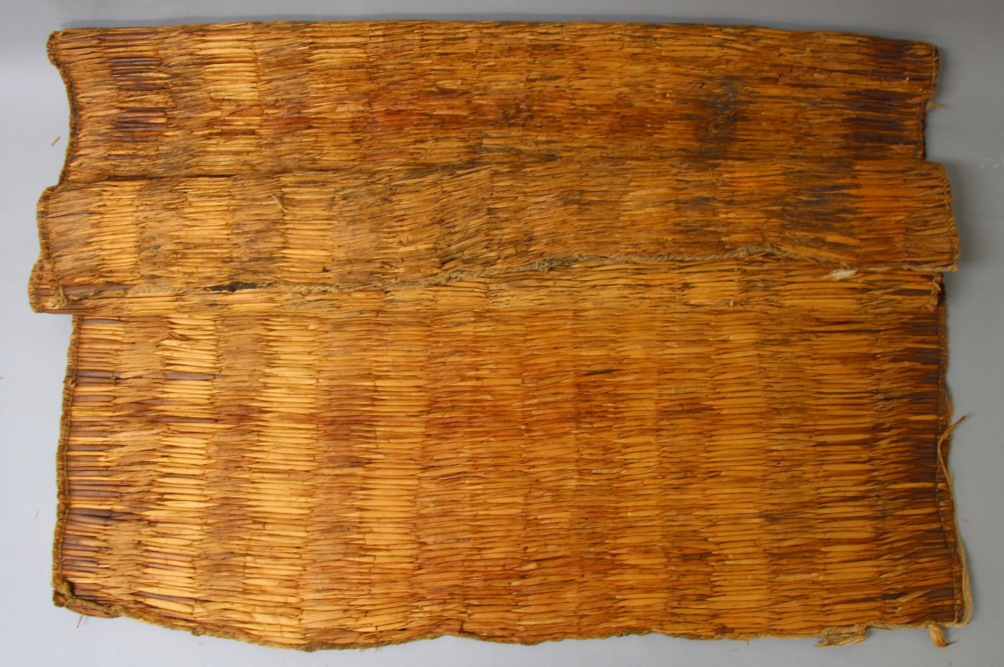 A mat made of reeds sewn together