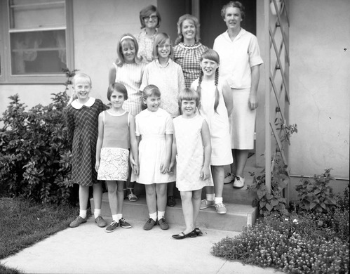 The women and girls of the Zion Canyon 4-H Cooking Club pose after winning at the Washington County Fair, June 1967. Back row left to right: C. Fisher, C. Hagood, L. Langan. Middle row left to right: Schaack, Brueck, Langan. Front row left to right: L. Hagood, P. Fisher, P. Hagood, P. Langan.