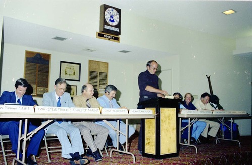 Color Photos of John Lancaster's farewell party at Elks Club in St. George, Utah. Speakers at roast in front of room: Pipe Spring National Monument Superintendent, TWA Steve Tedder, Chief of Maintenance, Chief Naturalist, John Lancaster, Crazy D, Administrative Officer, Cedar Breaks National Monument Superintendent, Chief Ranger, Unknown Skier.
