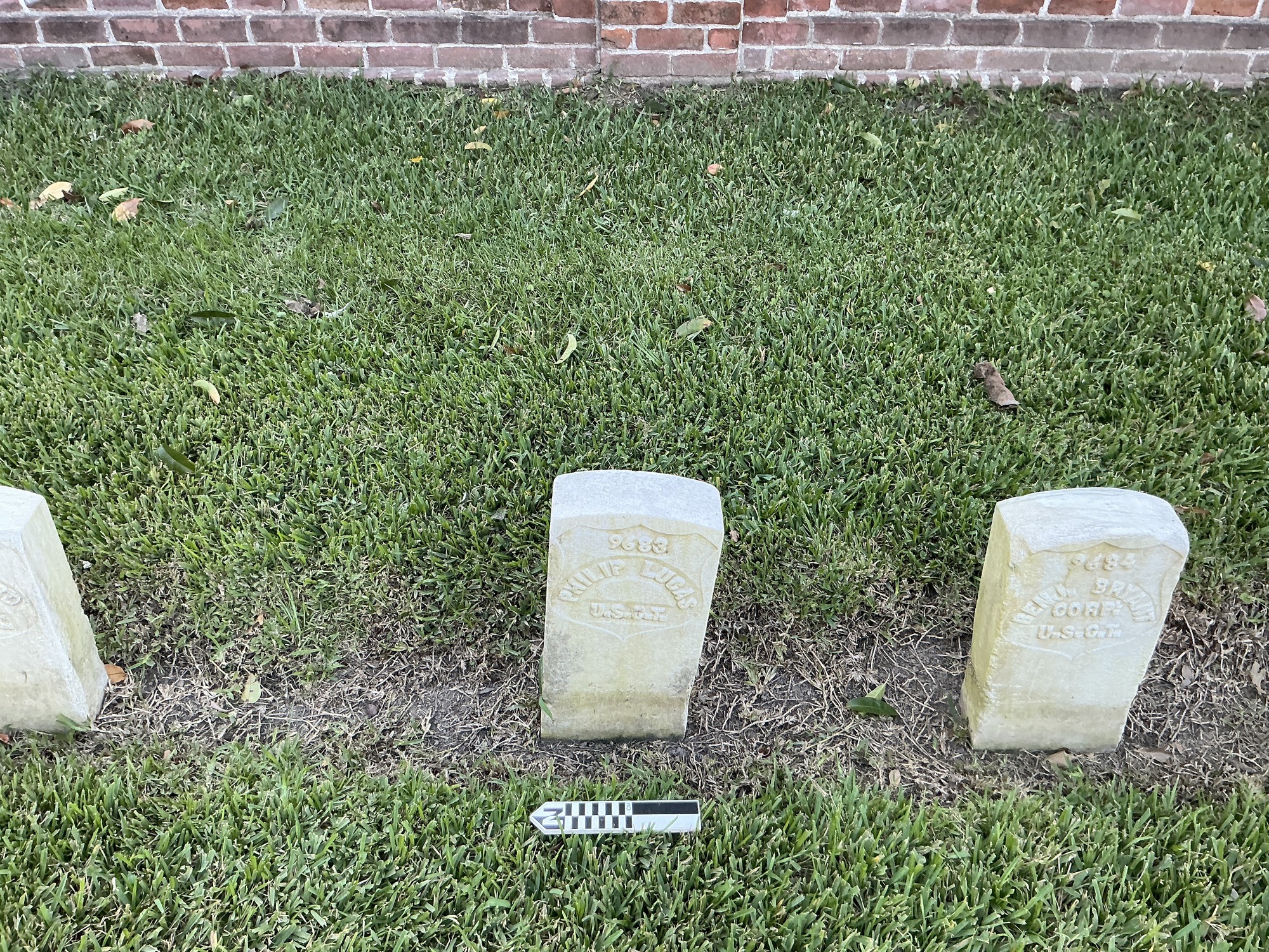 Extra image of historic upright marble headstone with recessed shield with recessed lettering face.