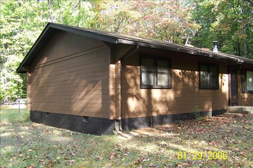 Repair insect/woodpecker damage on Quarters 3 at Prince William Forest Park in September 2009