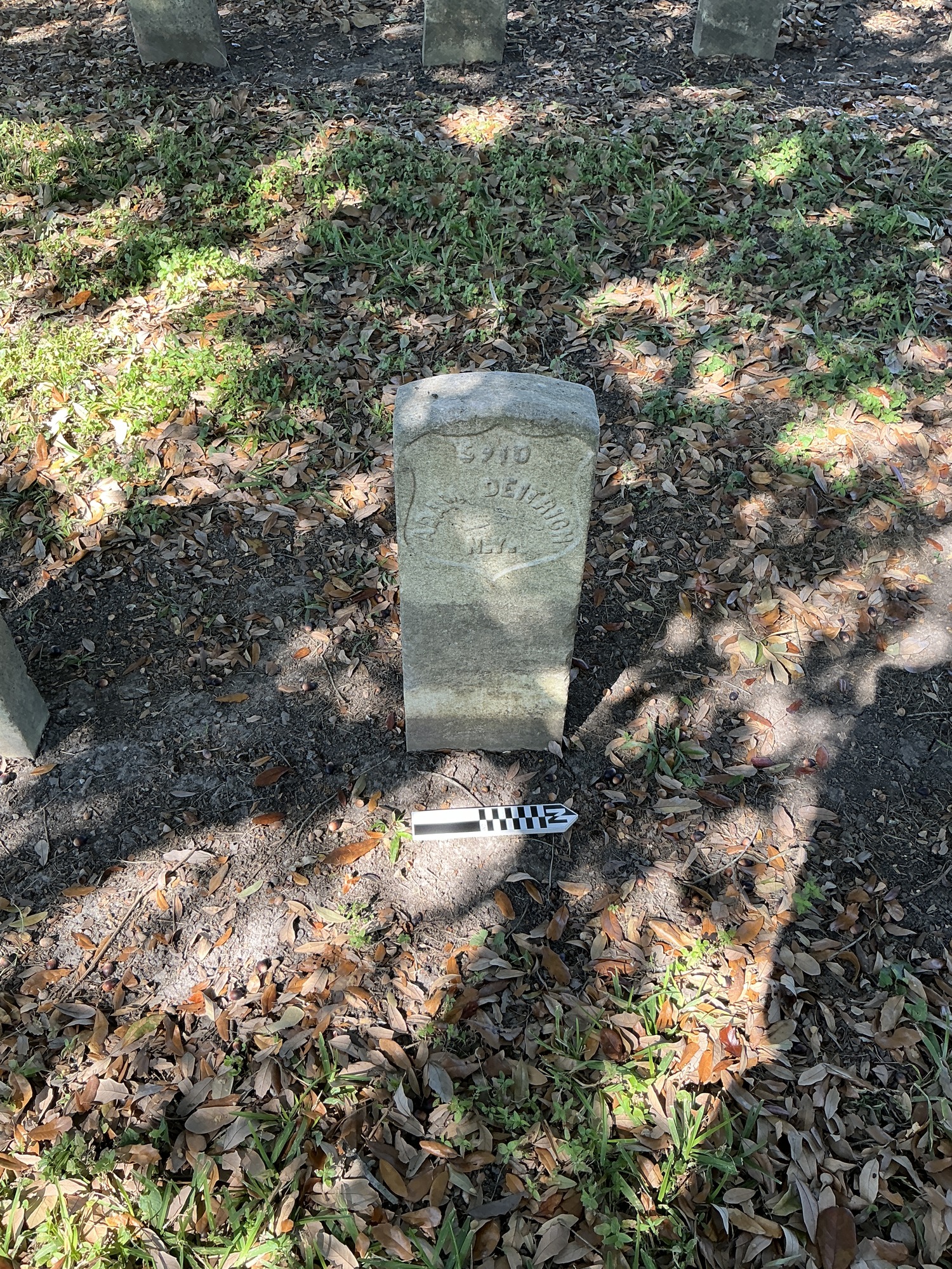 Extra image of historic upright marble headstone with recessed shield face.