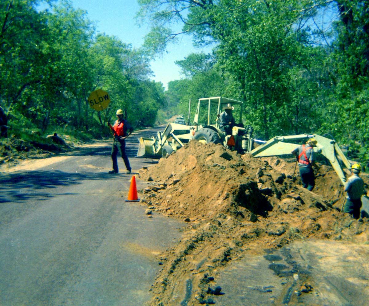 Construction vehicles and workers during the Zion Lodge utilities project.