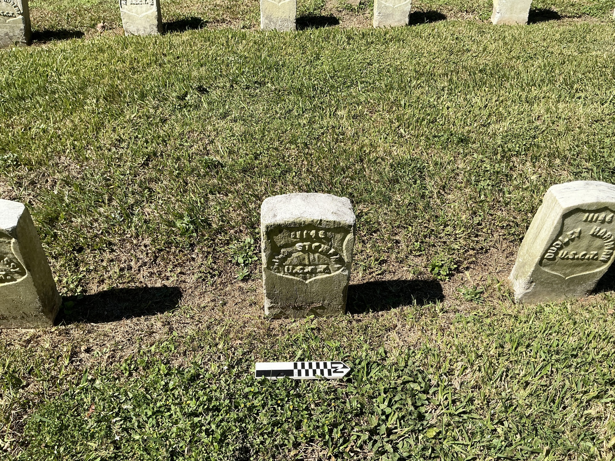 Extra image of historic upright marble headstone with recessed shield face.