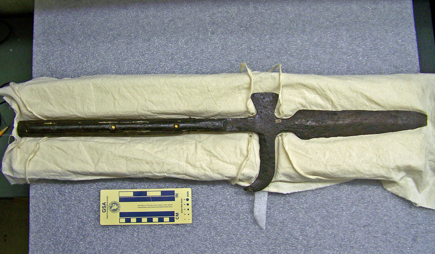 Halberd, Spanish, supposed artifact of DeSoto expedition through Arkansas; iron head, wooden handle banded in iron; head has spear-like point on end (with broken tip), small ax blade on one side, curved hook on opposite side; accompanied by image of John Fordyce drawing of original, sent to HOSP by Dr. Anne Early, Arkansas State Archeologist, in October 2011 (original drawing in archives at University of Arkansas - Fayetteville). Curator's Notes from 8/7/2014 and 10/15/2014: Halberd has been examined by Dr. Jeffrey Michem of AAS and determined likely to be an actual weapon from the DeSoto expedition and Spanish in origin.