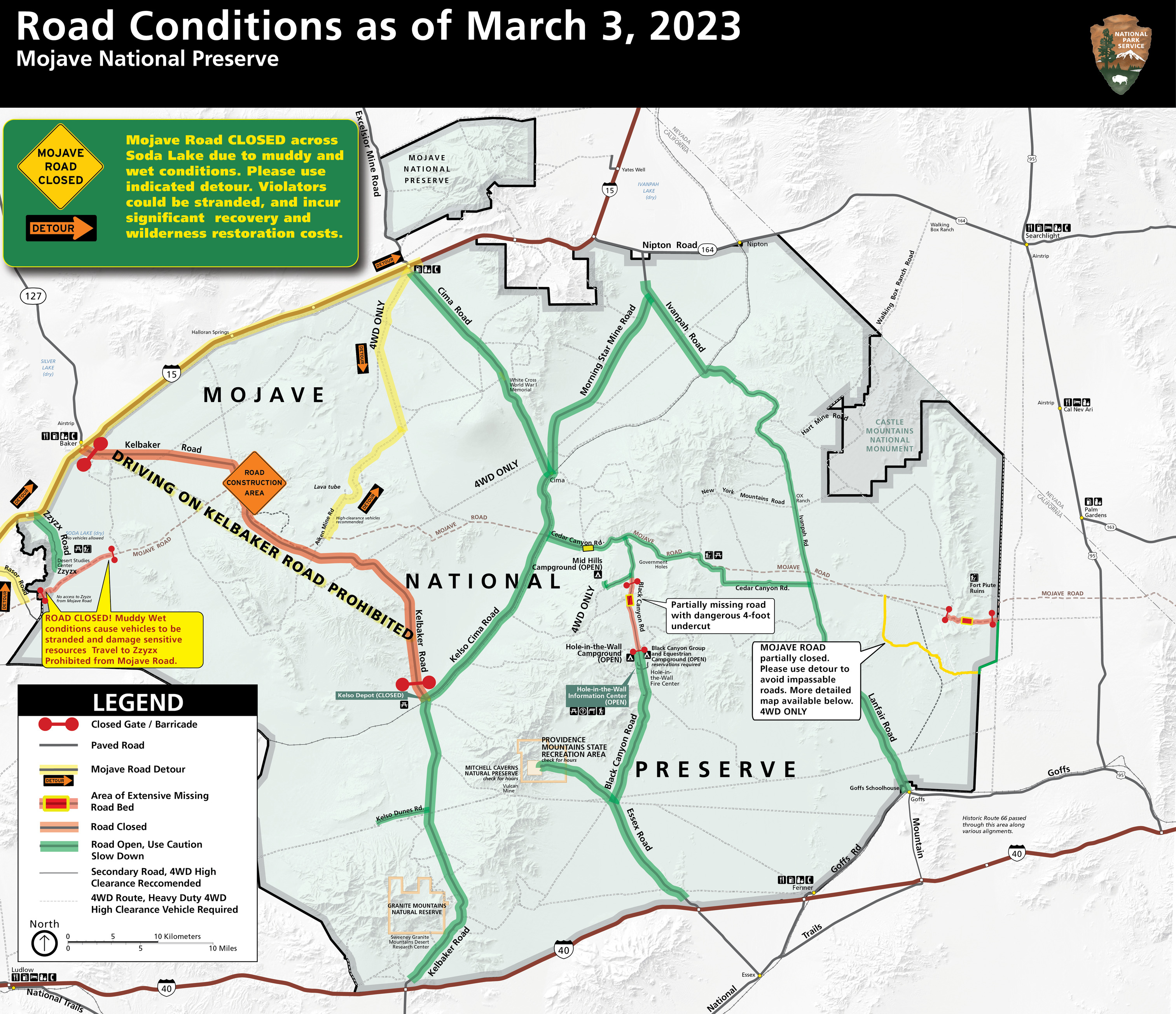 Road conditions map showing Mojave Road closed across Soda Lake.  Detour for Mojave Road shown in yellow via Rasor Rd, Interstate 15, Cima Rd, and Aiken Mine Rd. Kelbaker Road Closed between Kelso and Baker, shown in red, text reads Driving on Kelbaker Rd Prohibited. Northern section of Black Canyon Road between Hole in the Wall Campground and upper Wild Horse Canyon Road Closed.