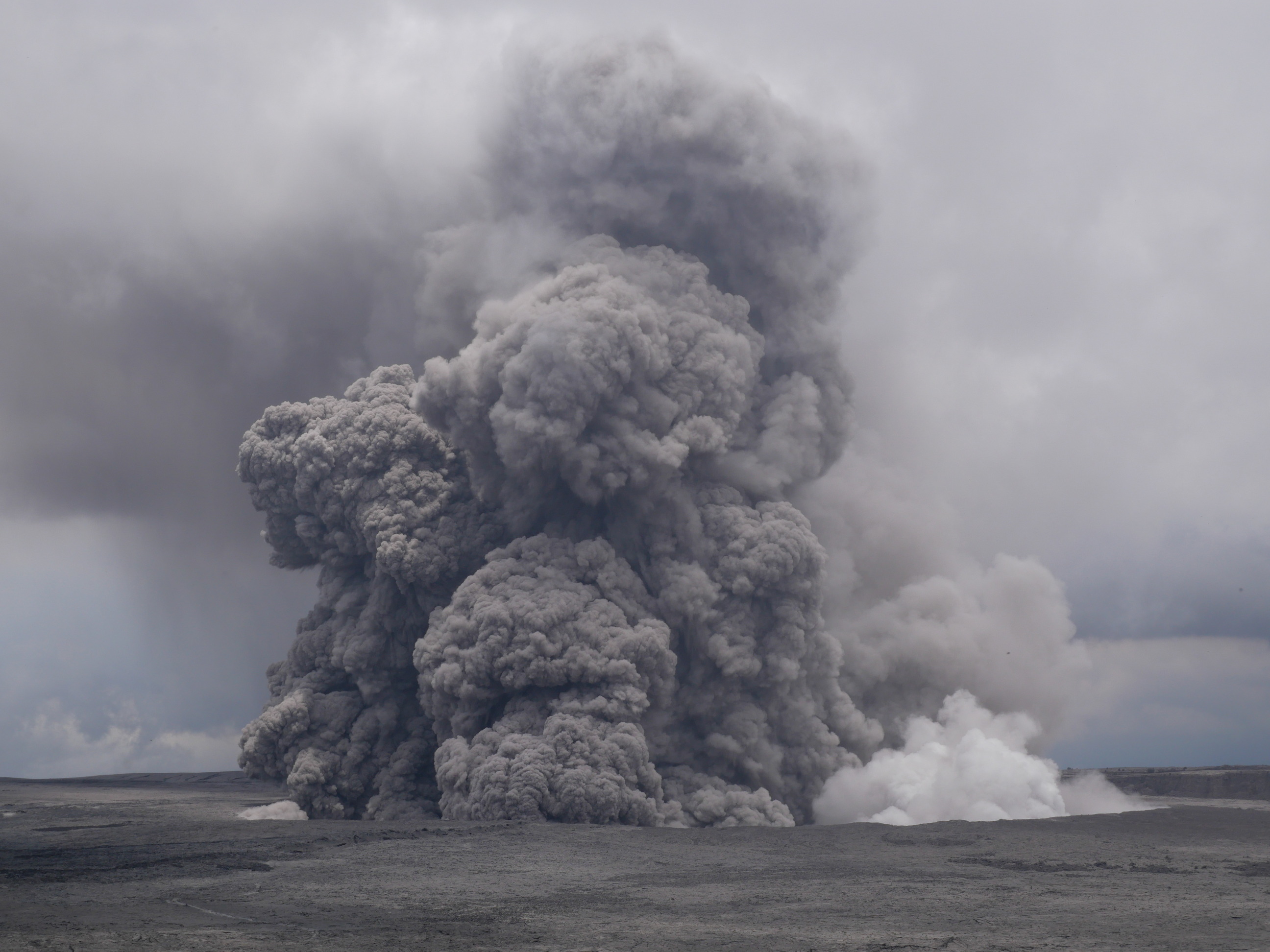 Cloud of ash and smoke rising from a volcanic crater