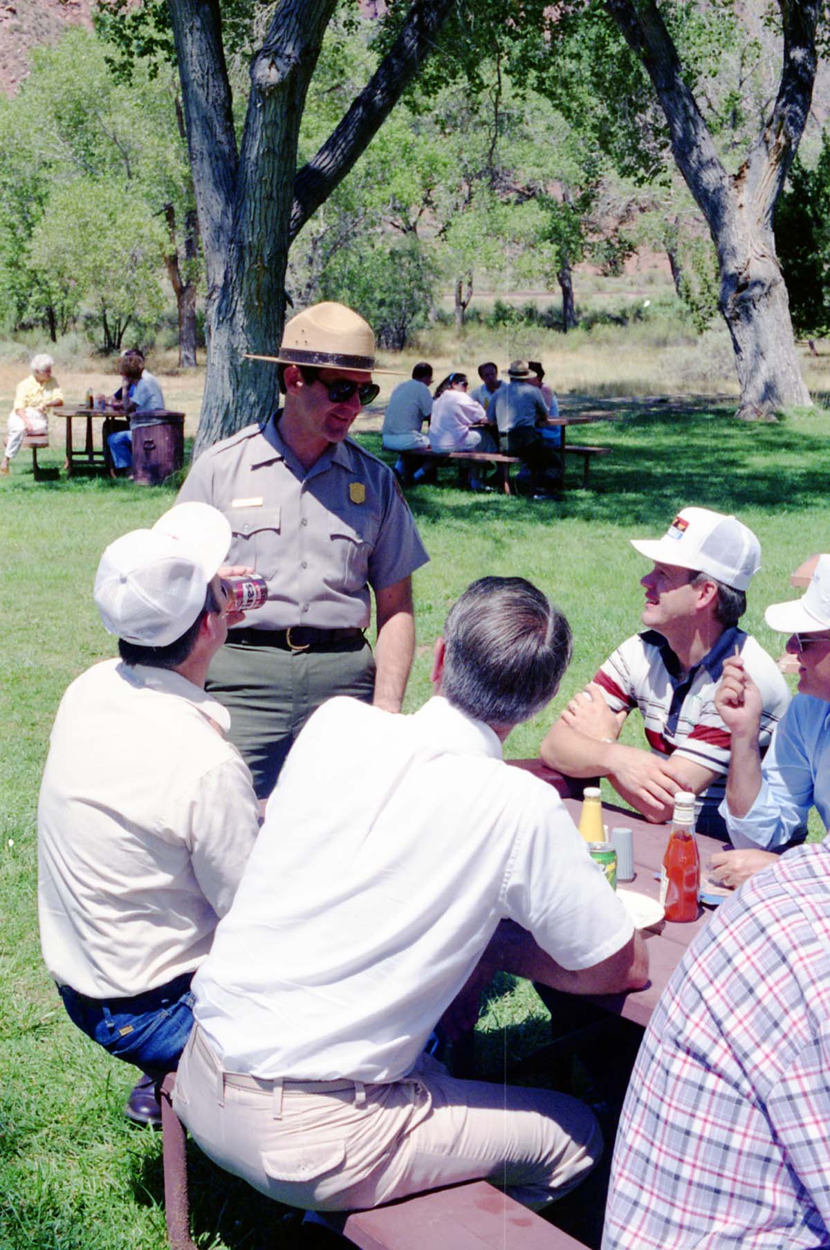 Color Photos of the parks 72nd anniversary celebrations- cake cutting, barbecue, speakers.