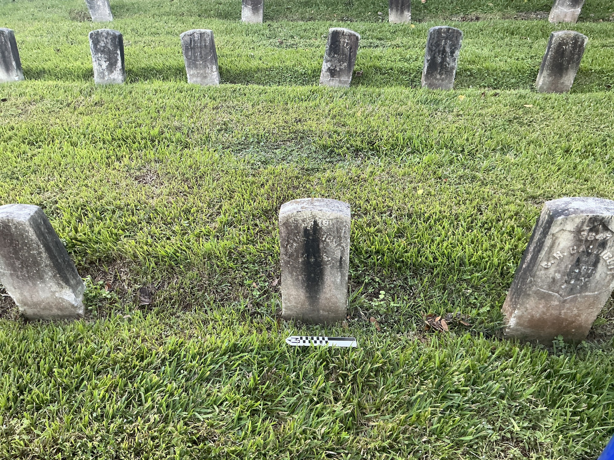Extra image of historic upright marble headstone with recessed shield face.