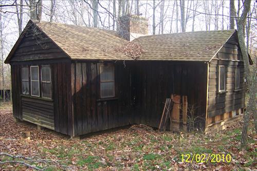 Rehabilitate historic cabin building 65 in camp Mawavi (Camp 2) at Prince William Forest Park in December 2010