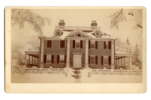 Front facade of Georgian mansion in the snow