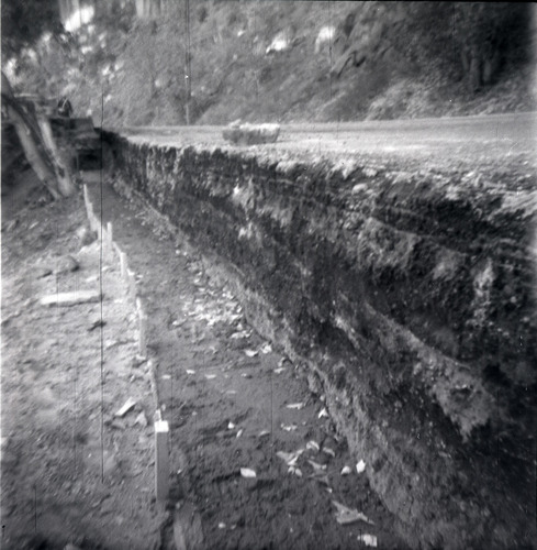 Rock retaining wall alongside road at the tunnel during rebuilding.