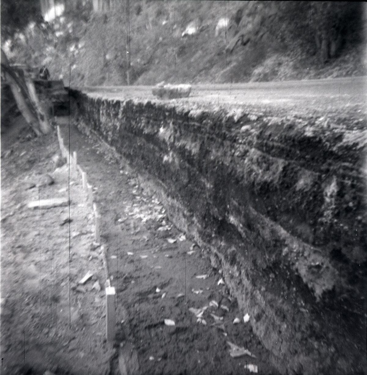 Rock retaining wall alongside road at the tunnel during rebuilding.
