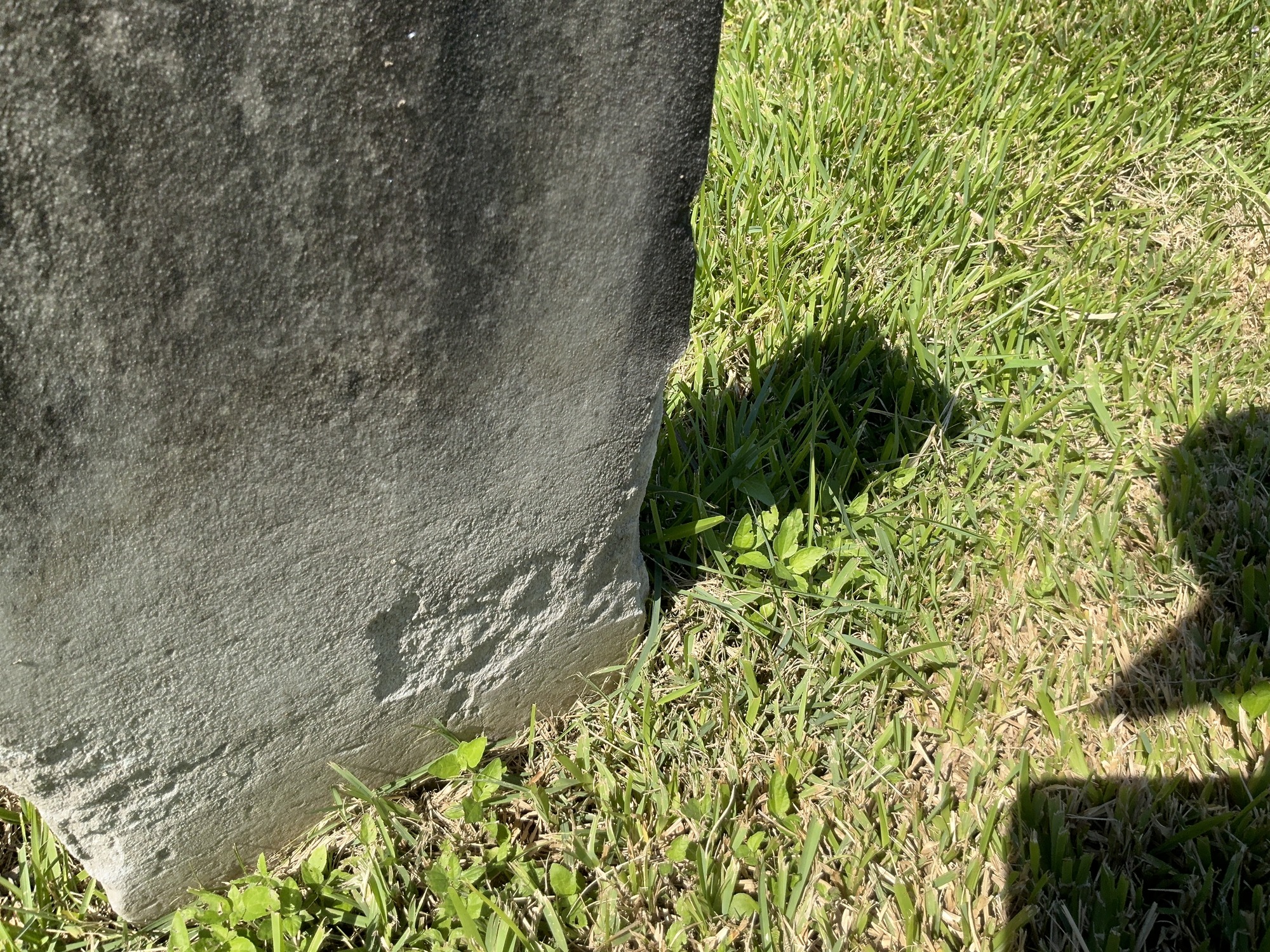 Extra image of historic upright marble headstone with recessed shield face.