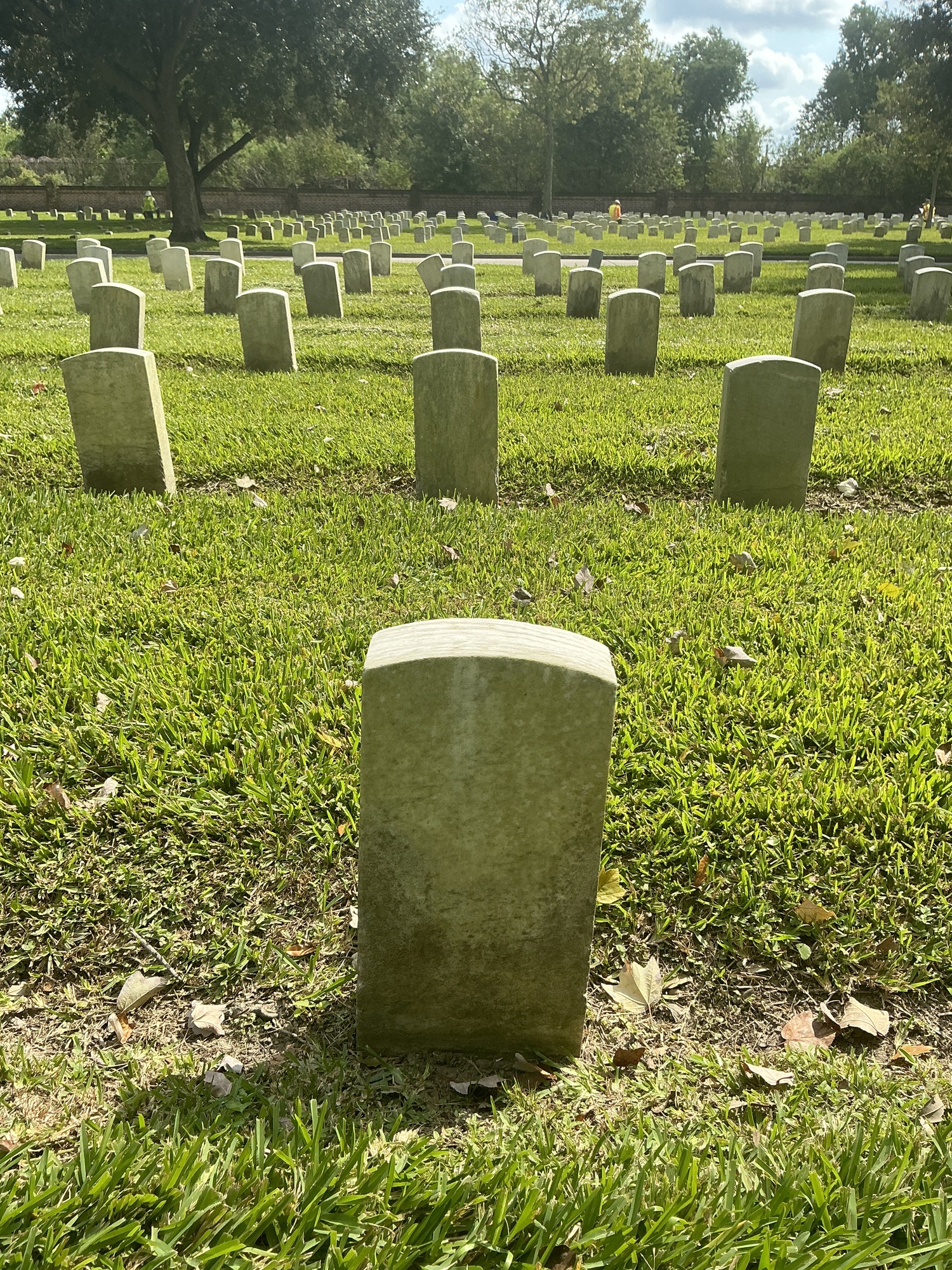 Extra image of historic upright marble headstone with recessed shield face.