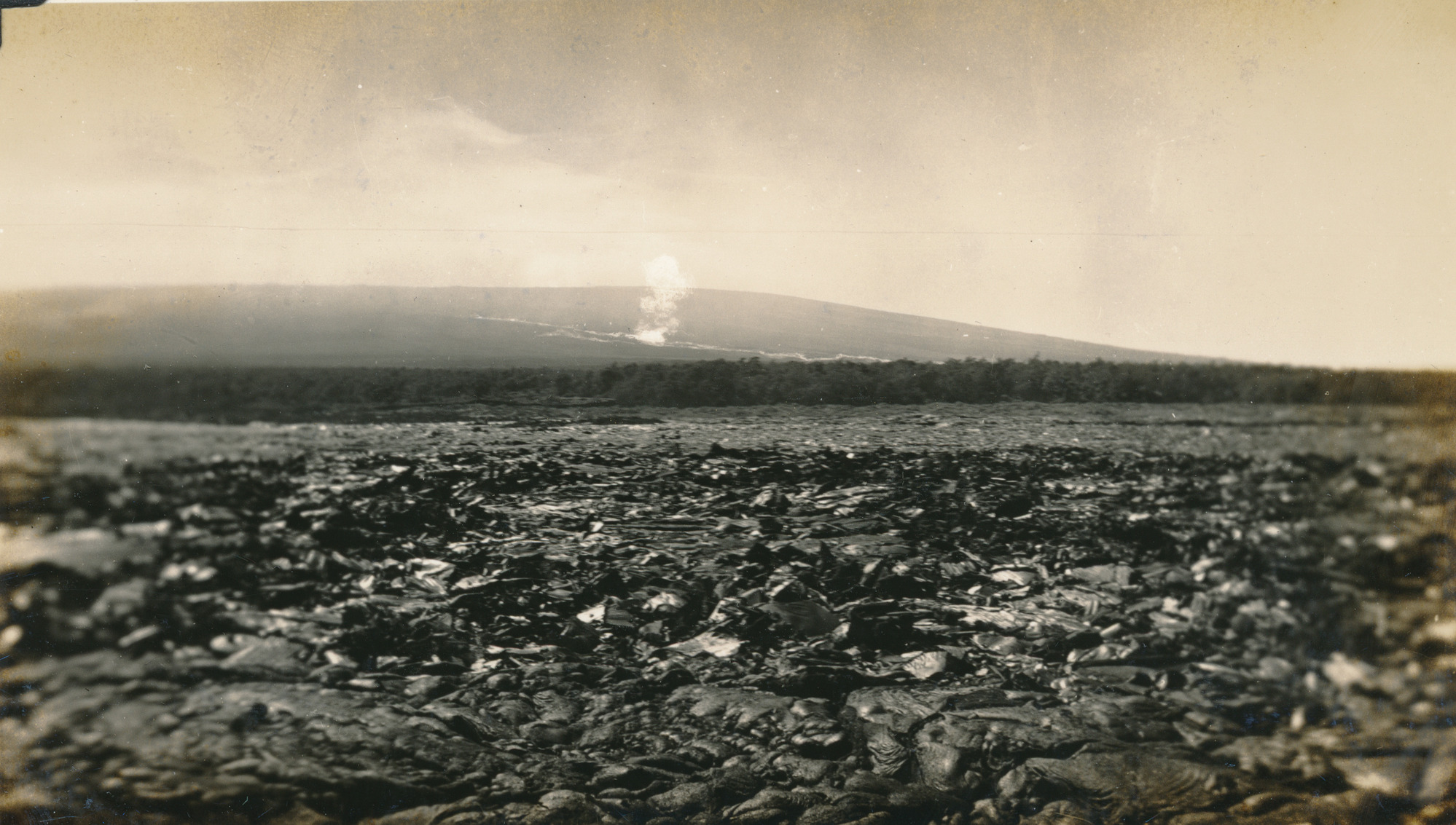 A photograph of Mauna Loa being bombed. 