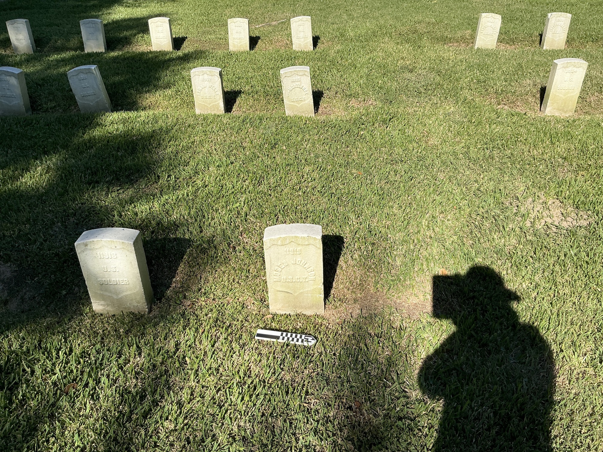 Extra image of historic upright marble headstone with recessed shield face.