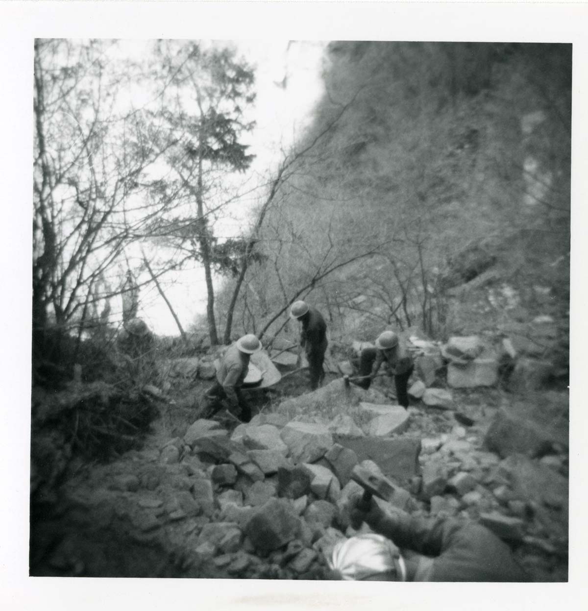 Workers repairing trail damage on the Hidden Canyon trail.