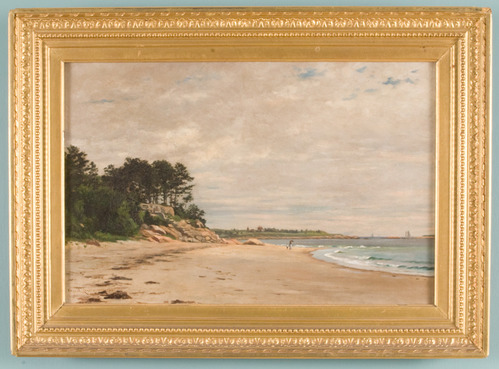 Landscape of beach scene with rocky formation and trees at left and waves at right