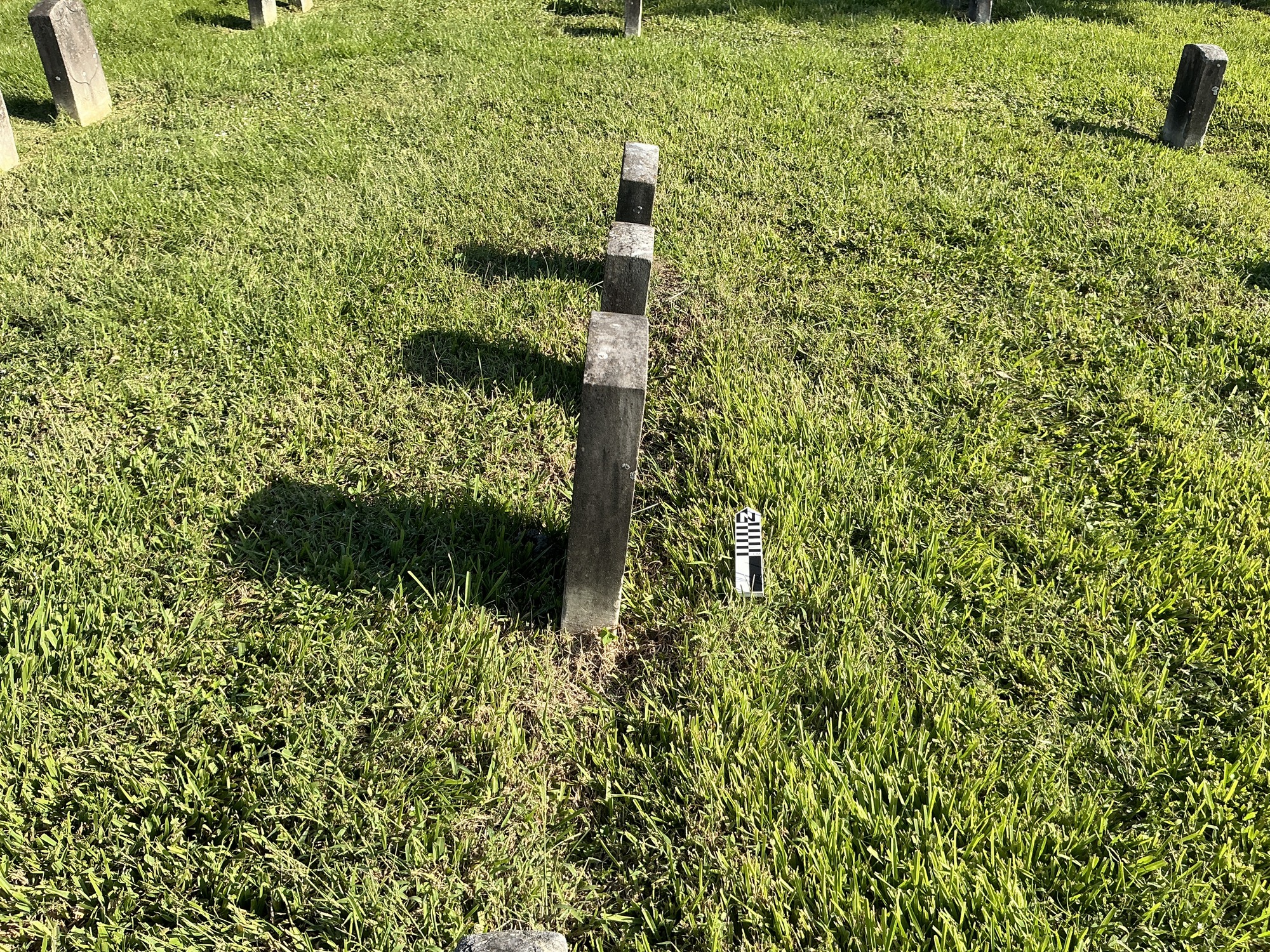 Extra image of historic upright marble headstone with recessed shield face.