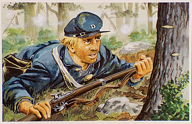 Union soldier, under fire, lying on ground for cover.