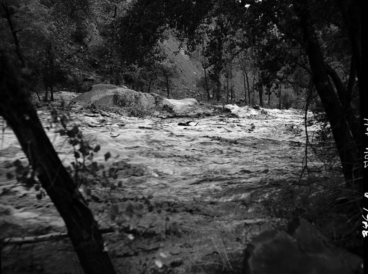 Virgin River in flood stage at the area of the 'Great Slide' below the Court of the Patriarchs. This flood claimed the lives of 5 hikers in the Narrows.