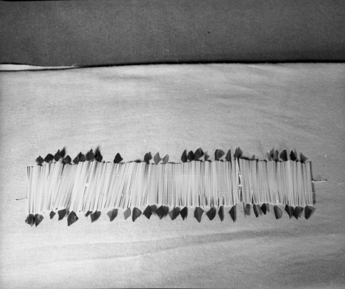 Marie Rozier Collection, Catalog No. 212. Object: False headband. Dimensions: 18 x 5 1/2". Materials: commercial leather, blackbird feathers, orange plastic window shade. Collection History: made to simulate flicker quill headband expressly for Marie Rozier's collection by Craig Bates, made in 1968. Photographed by Michael Dixon in December 1982. Catalogued by Craig Bates and Barbara Beroza. Yosemite Collections, National Park Service.