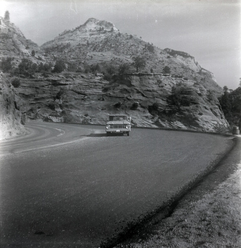 Truck driving down road during east side road repair and turn out construction.
