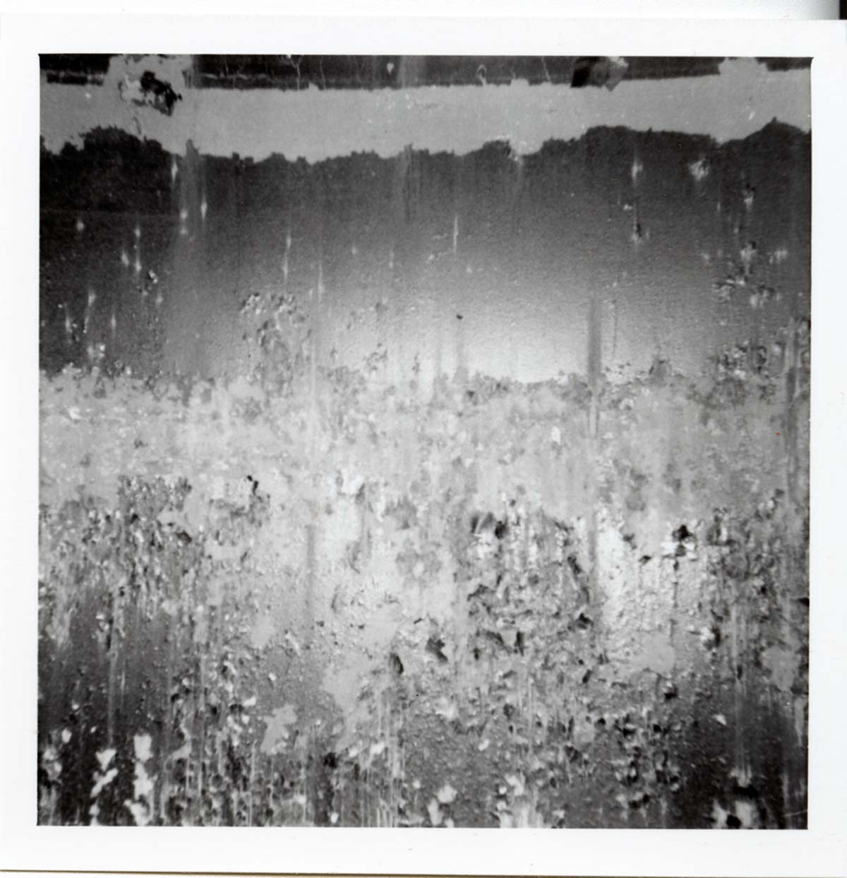 The interior of the 40000 gallon water tank showing buildup/corrosion.