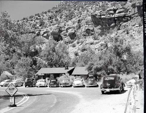 Zion Museum at Canyon Junction with vehicles parked in front.