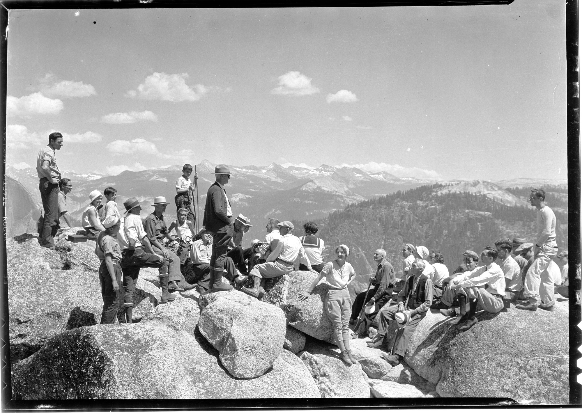 Eagle Peak all day hike. Typical group of hikers on top of Eagle Peak overlooking Yosemite high country. Ranger naturalist Thaxter in center.