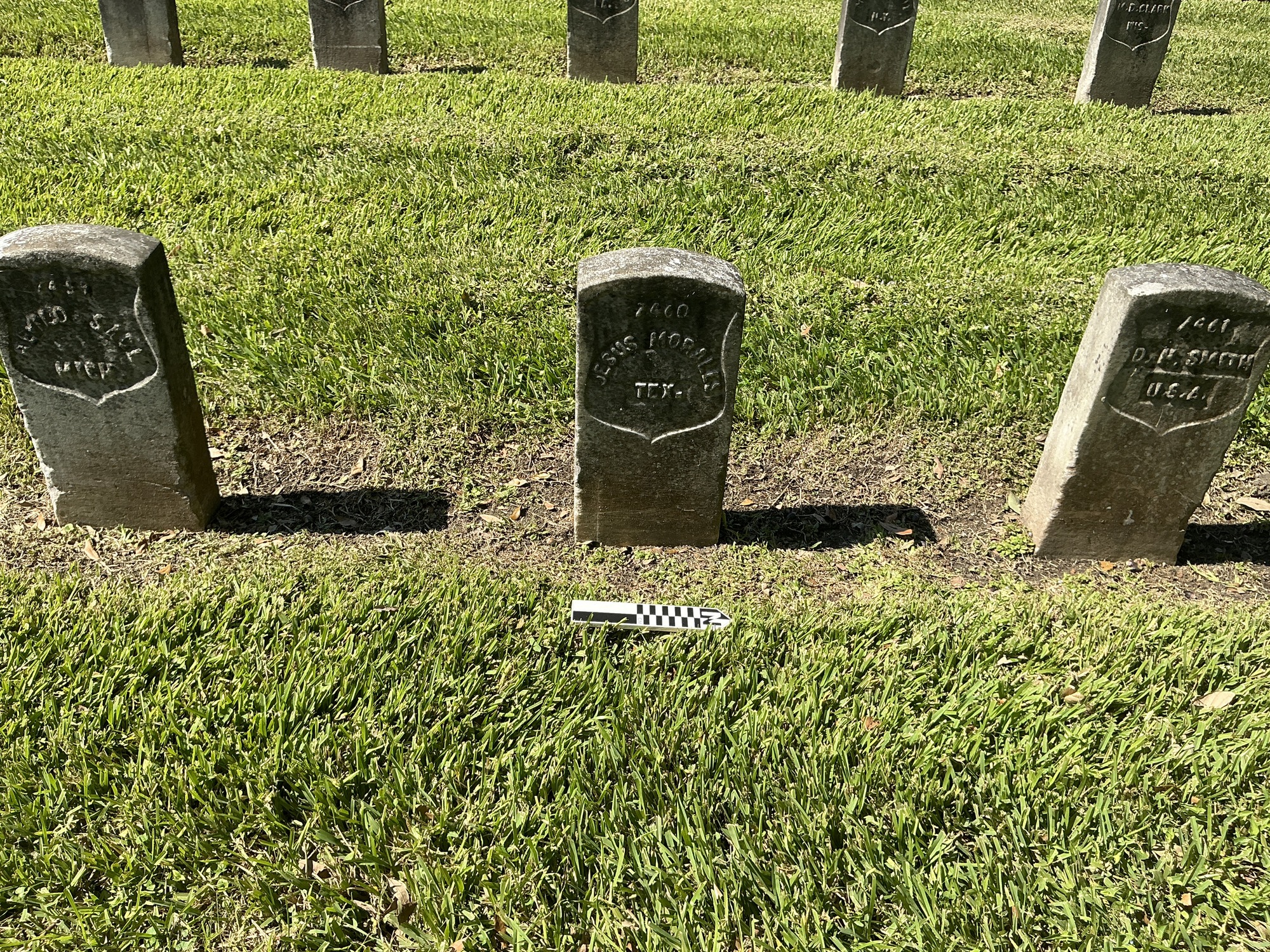 Extra image of historic upright marble headstone with recessed shield with recessed lettering face.
