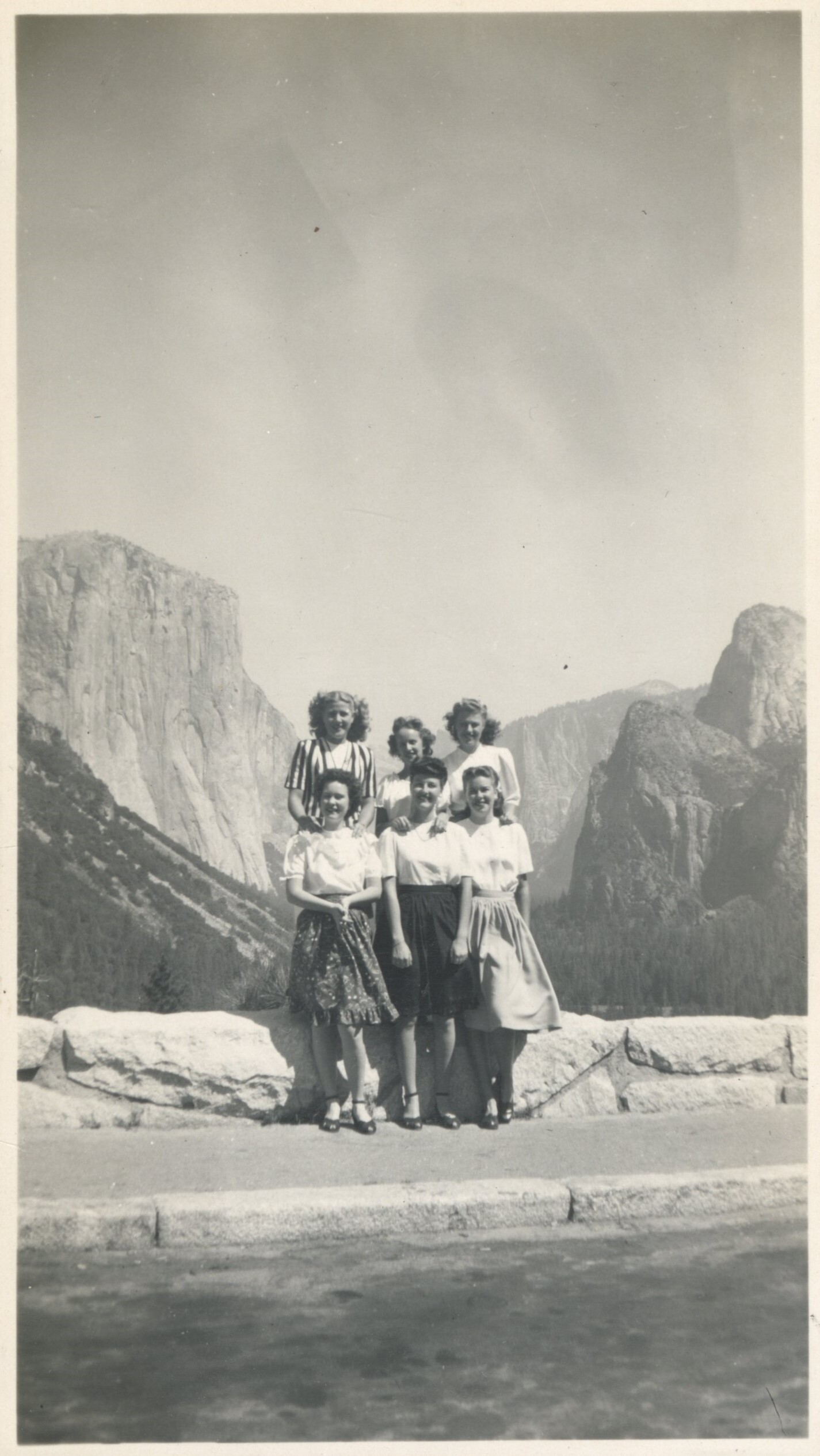 Six nurses stand in front of Tunnel View