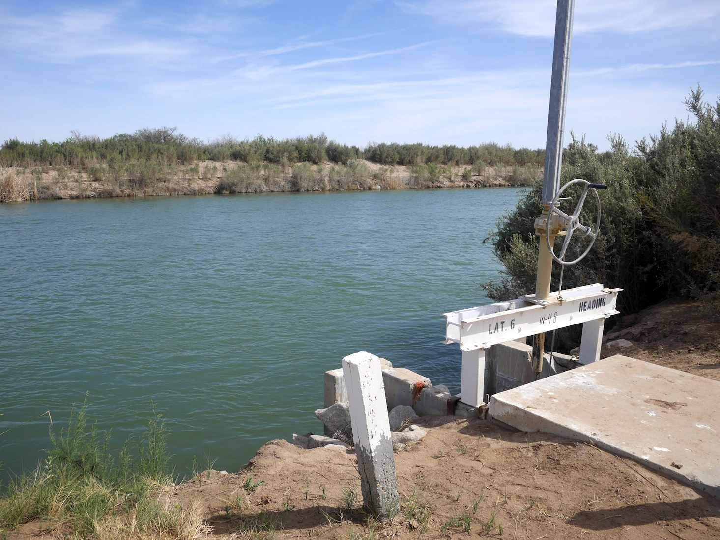 A boat launch on the shore of a small body of water