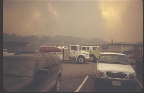 Firefighters provide structural protection to commercial buildings during the Bircher fire, Mesa Verde National Park, July 2000