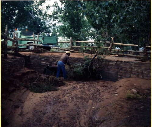 Color photo of flood damage at Pipe Spring National Monument.