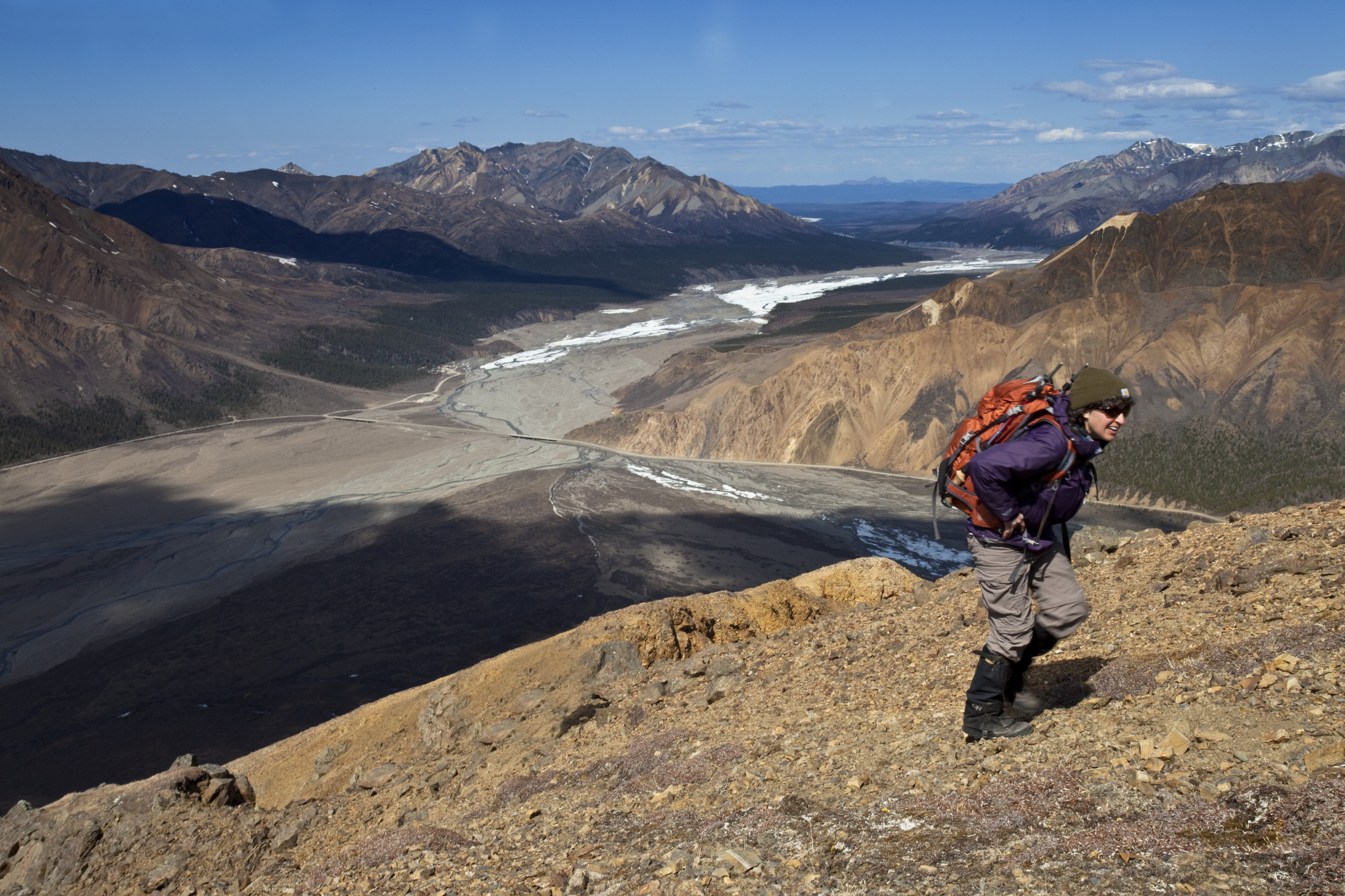 woman hiking up a mountain