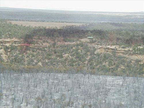 Aerial views of Chapin Mesa area in and around buildings depicting burn areas in the aftermath of the Long Mesa Fire at Mesa Verde National Park, August 2002