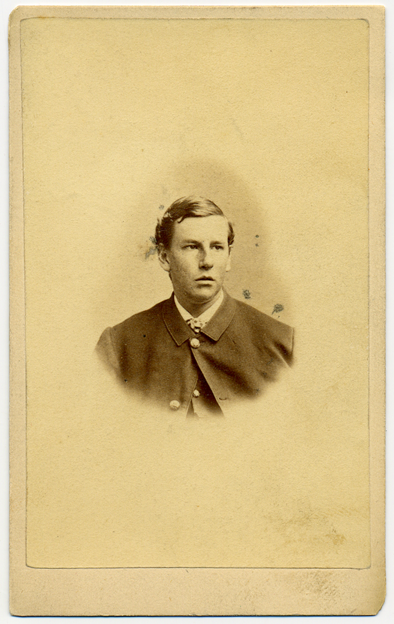 Bust length portrait of young man in military uniform.