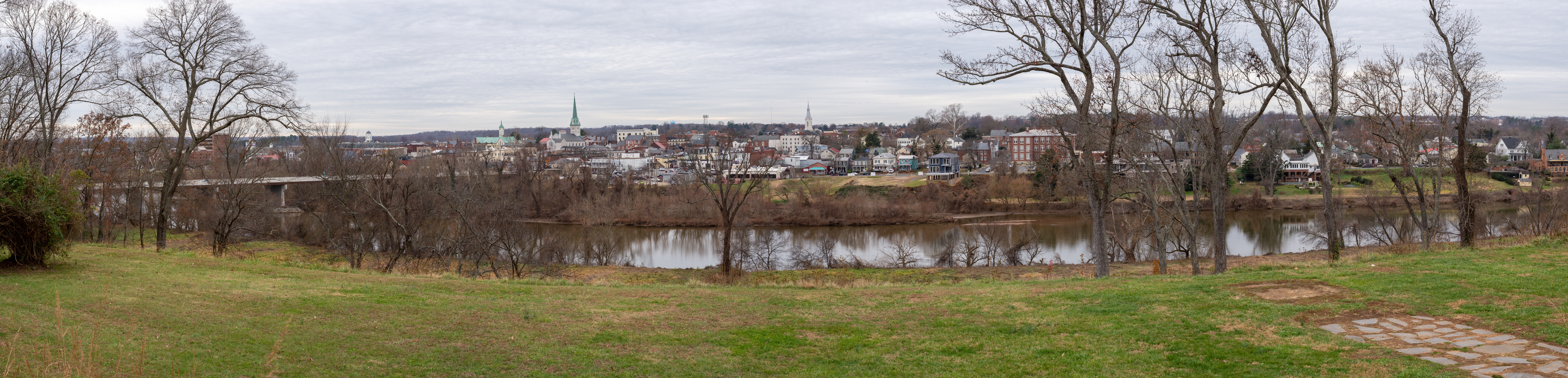 Cityscape in winter across a river.