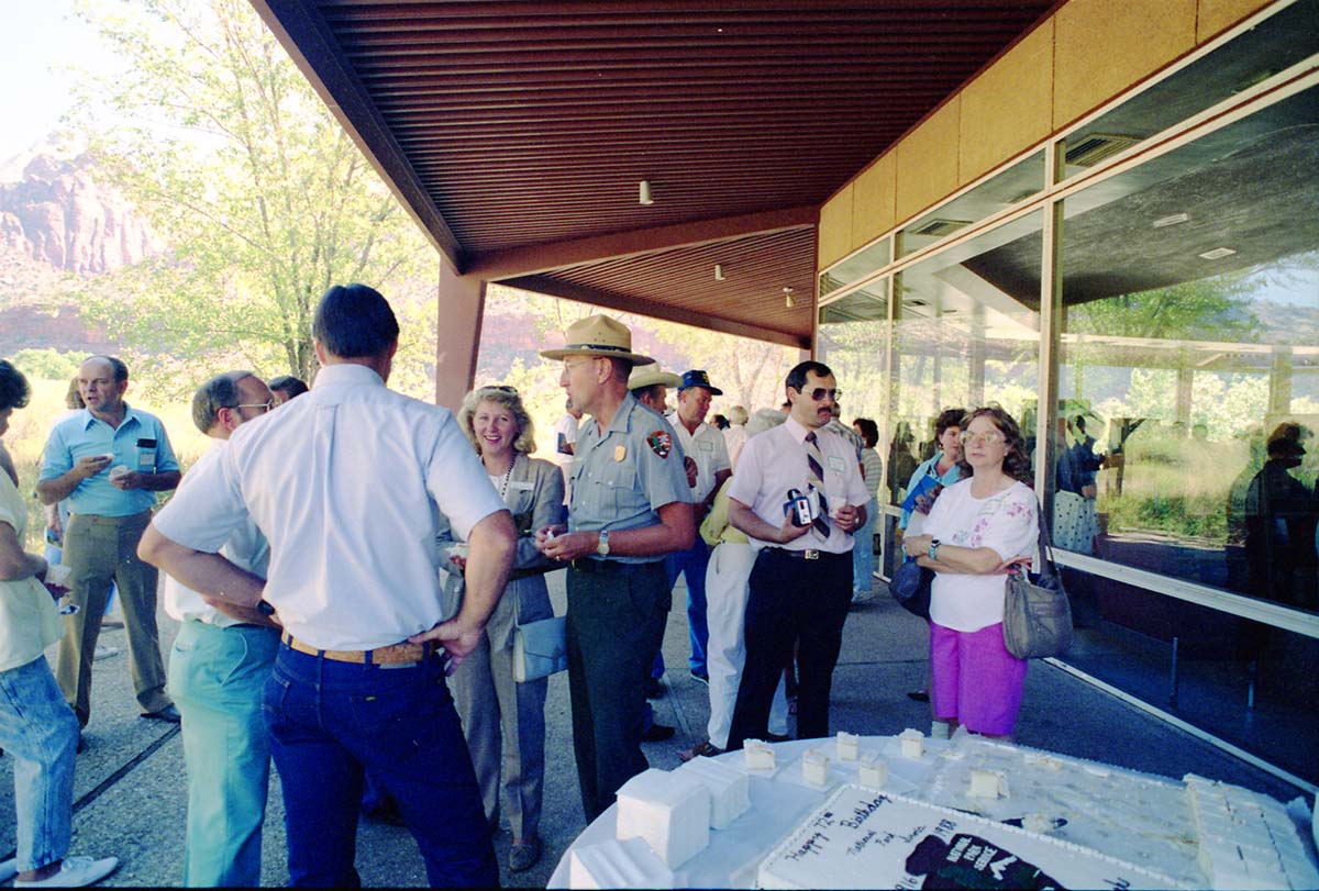 Color Photos of the parks 72nd anniversary celebrations- cake cutting, barbecue, speakers.