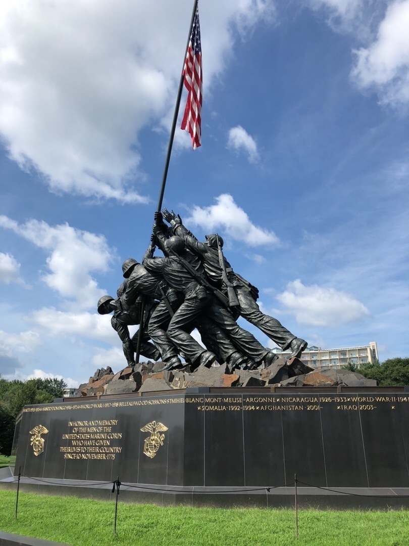 The US Marine Corps War Memorial, portraying several soldiers raising a flag, based off of the iconic 'Raising the Flag on Iwo Jima' photo. 