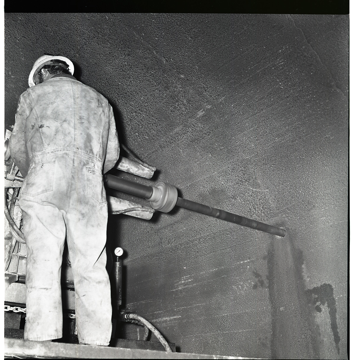 Machinery and operator drilling test cores in Zion-Mt. Carmel tunnel.