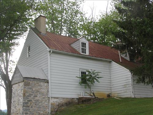Exterior of the william Roulette Farmhouse in June 2010